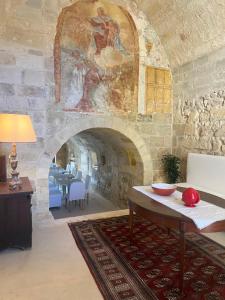 Ένα ή περισσότερα κρεβάτια σε δωμάτιο στο Masseria Eirene