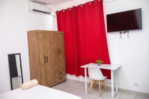 TV a/nebo společenská místnost v ubytování Sulam Luxury Hotel Nicaragua