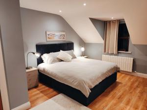 Postel nebo postele na pokoji v ubytování Suíomh Álainn