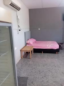 En eller flere senge i et værelse på Santino