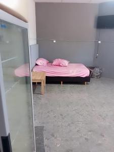 En eller flere senge i et værelse på Santino