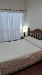 En eller flere senge i et værelse på Casa Julia