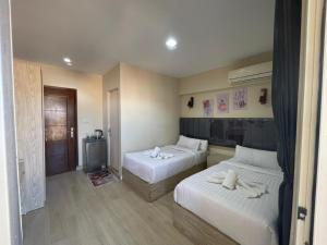 Ένα ή περισσότερα κρεβάτια σε δωμάτιο στο Lorenda hotel