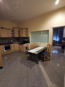 a kitchen with a table and chairs and a chalkboard at Ferienwohnung-Monteurwohnung-Parkplatz in Meine +6 photos