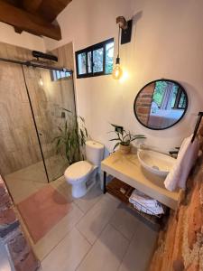 a bathroom with a toilet and a sink and a shower at Montecafé Jardín in Jardin
