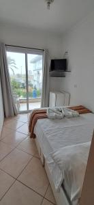 Ένα ή περισσότερα κρεβάτια σε δωμάτιο στο Pousada Mar Alto