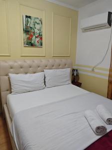 Ένα ή περισσότερα κρεβάτια σε δωμάτιο στο Center Rooms