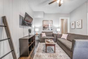 a living room with a couch and a table at The Clearview Hideaway - Cozy in Memphis
