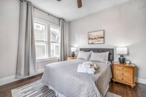 a bedroom with a bed with a teddy bear on it at The Clearview Hideaway - Cozy in Memphis