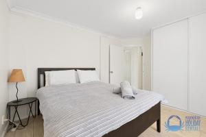 Ένα ή περισσότερα κρεβάτια σε δωμάτιο στο The Treehouse in Greenfields Mandurah +30 φωτογραφίες