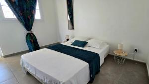 Postel nebo postele na pokoji v ubytování La Fleur Doré F3 Le Vauclin