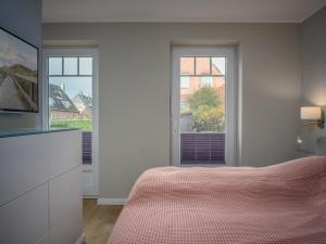 Giường trong phòng chung tại Wolkentanz - zeitlos wohnen für BEST AGER