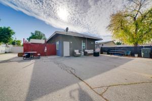 a garage with a red fence and a building at Work and Play! Studio Retreat 2 Mi to Dtwn Riverside in Riverside