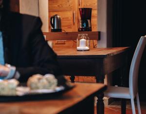 a table with a candle and a plate of food at B&B Lo Matsòn in Chambave