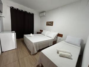 Кровать или кровати в номере CANAS Praia Hotel Lounge +42 фотографии