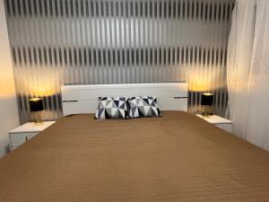 Ένα ή περισσότερα κρεβάτια σε δωμάτιο στο 3 Barát Apartman