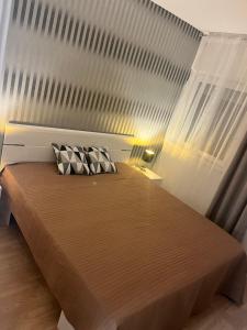 Ένα ή περισσότερα κρεβάτια σε δωμάτιο στο 3 Barát Apartman