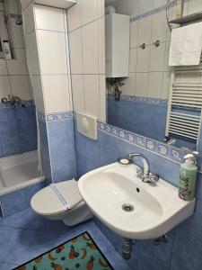 a bathroom with a sink and a toilet at Happy apartment-OldTown Sarajevo in Sarajevo