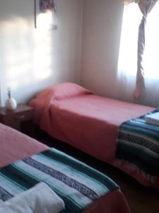 Ένα ή περισσότερα κρεβάτια σε δωμάτιο στο Cabaña familiar