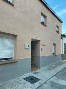 a brick building with a door and a window at Morada del Santo in Fontiveros
