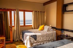 Ένα ή περισσότερα κρεβάτια σε δωμάτιο στο AST Surf Hotel