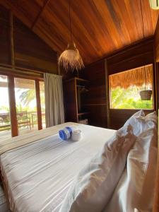 Giường trong phòng chung tại Villa Caravelas Praia de Moitas +118 ảnh