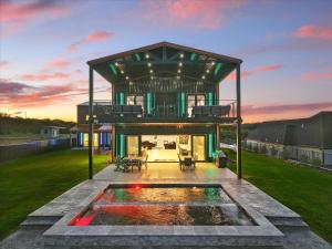 a house with a pool in the middle of a yard at AP Lodge in Graham