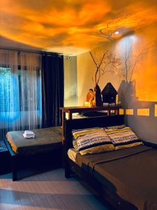 a bedroom with two beds and a ceiling at WN Hilltop B&B by Smart Stay 2600 in Baguio