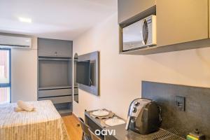 En eller flere senge i et værelse på Flats no Mares de Cabo Branco by QAVI + 29 billeder