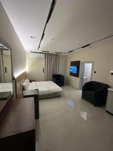 En eller flere senge i et værelse på Relax Home