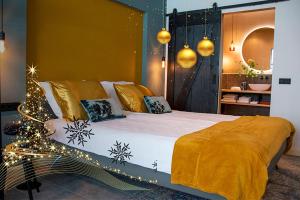 a bedroom with a large bed with christmas lights at B and B Suite No.3 in Gorinchem
