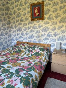 Ένα ή περισσότερα κρεβάτια σε δωμάτιο στο Le Manoir