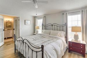 a bedroom with a large bed and a window at Scenic Sandia Mtn Views! Cozy Rio Rancho Retreat in Paradise Hills