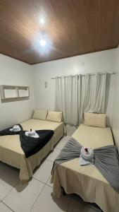 Postel nebo postele na pokoji v ubytování Casa Temporada - ACONCHEGO DOS LENCOIS