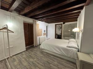 Ένα ή περισσότερα κρεβάτια σε δωμάτιο στο El Torreón 1870