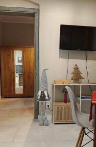 a room with a gnome standing in a living room at Weranda in Bytom