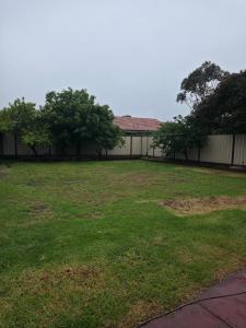 an empty yard with trees and a building at Westcott in Rockbank +2 photos