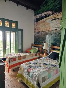 Postel nebo postele na pokoji v ubytování Rancho São Francisco de Assis - 2 suítes