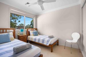 Ένα ή περισσότερα κρεβάτια σε δωμάτιο στο Spectacular - Belle Escapes Jervis Bay