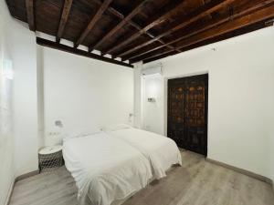 Ένα ή περισσότερα κρεβάτια σε δωμάτιο στο El Torreón 1870