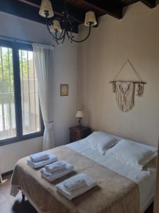 En eller flere senge i et værelse på Casita Mumi