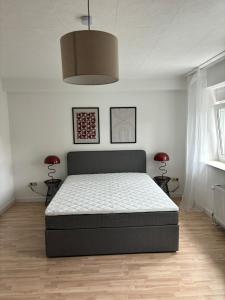 Ένα ή περισσότερα κρεβάτια σε δωμάτιο στο LAHNBLICK 3 Schlafzimmer, Parkplatz, WLAN