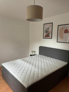 Ένα ή περισσότερα κρεβάτια σε δωμάτιο στο LAHNBLICK 3 Schlafzimmer, Parkplatz, WLAN +1 φωτογραφίες