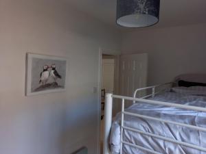 Postel nebo postele na pokoji v ubytování The Owlery Alnwick