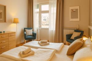 En eller flere senge i et værelse på City Break Apartments - City Zen