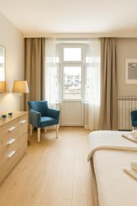 En eller flere senge i et værelse på City Break Apartments - City Zen