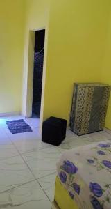 Ένα ή περισσότερα κρεβάτια σε δωμάτιο στο Hostel do aconchego