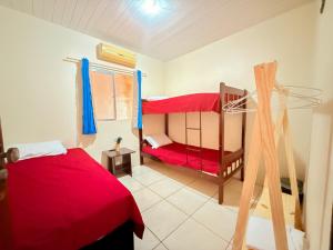 Ένα ή περισσότερα κρεβάτια σε δωμάτιο στο Pousada Varanda