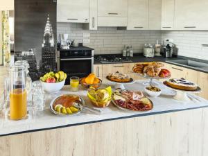 a table with many different types of food on it at B&B Il Grande Cipresso Recanati in Castelnuovo