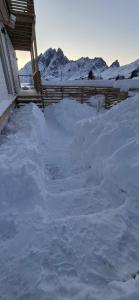 a pile of snow on the side of a house at Aurora Bay Villa Lofoten in Sund